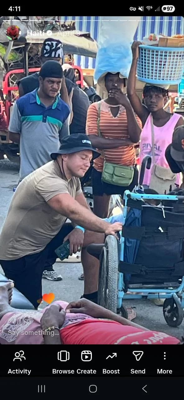 Dr. Nilsson providing chiropractic care on the streets of Haiti